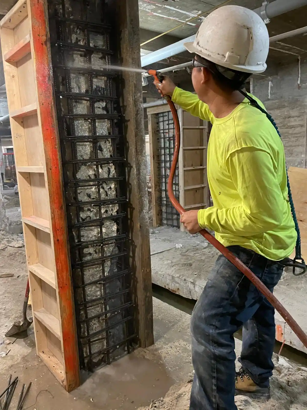 Surface preparation of a structural column prior to concrete repairs at the Delano Hotel in Miami Beach, Florida